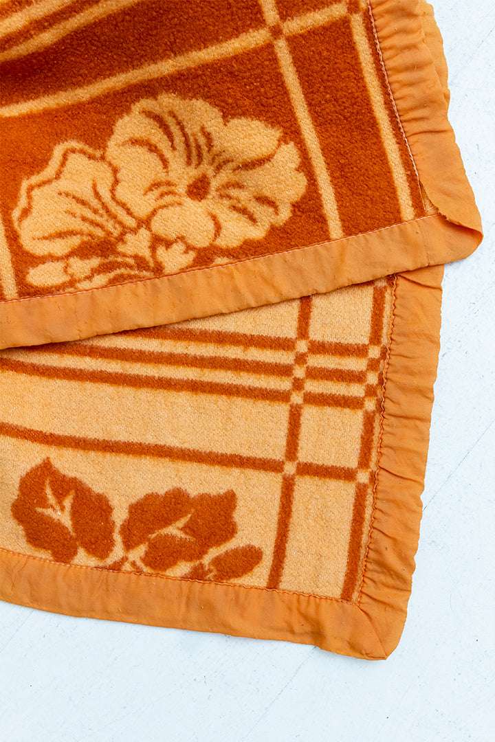 Oranje vintage wollen deken met bloemen