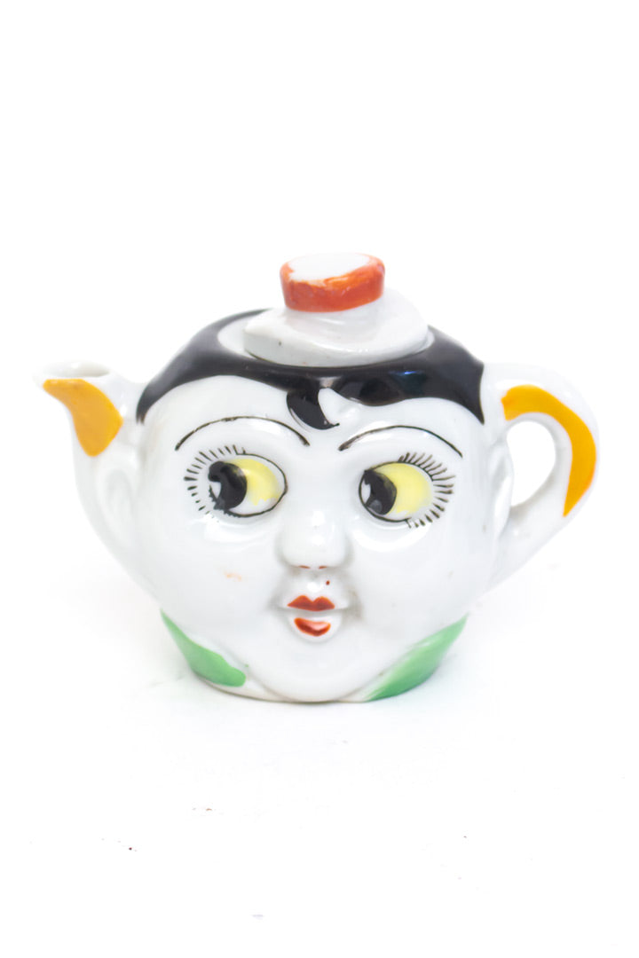 Vintage kinderservies met gezichtjes en googly eyes jaren 20 art deco