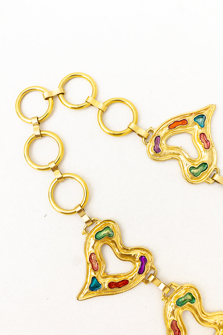 Vintage riem hartjes van goudkleurig metaal met gekleurde lak