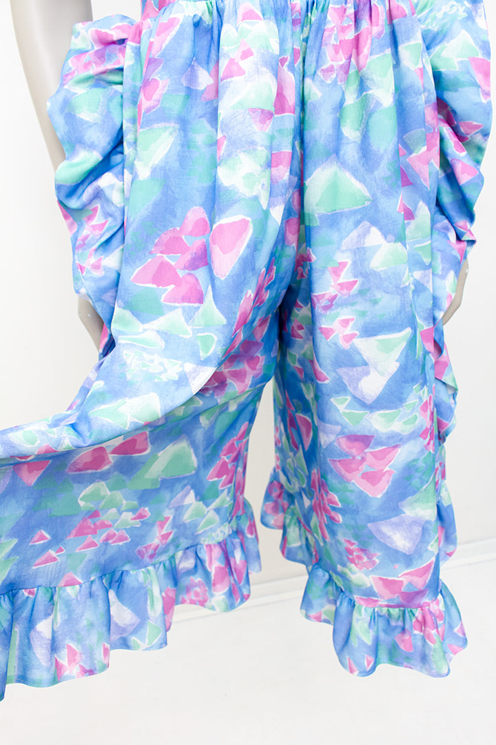 Asymmetrische vintage jumpsuit met ruches en vrolijke pasteltinten