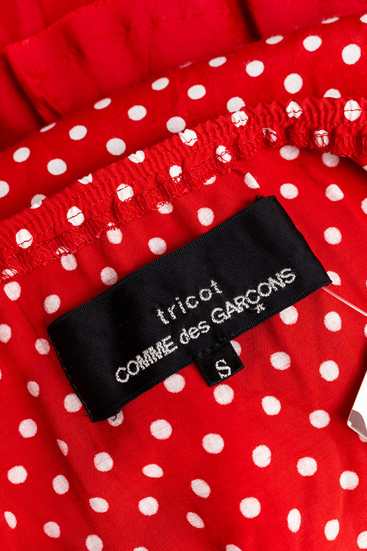 Comme des Garçons rode jurk met witte stippen en rushes