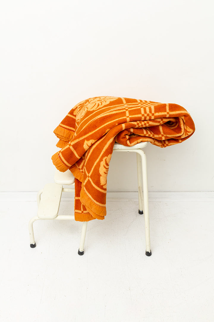 Oranje vintage wollen deken met bloemen
