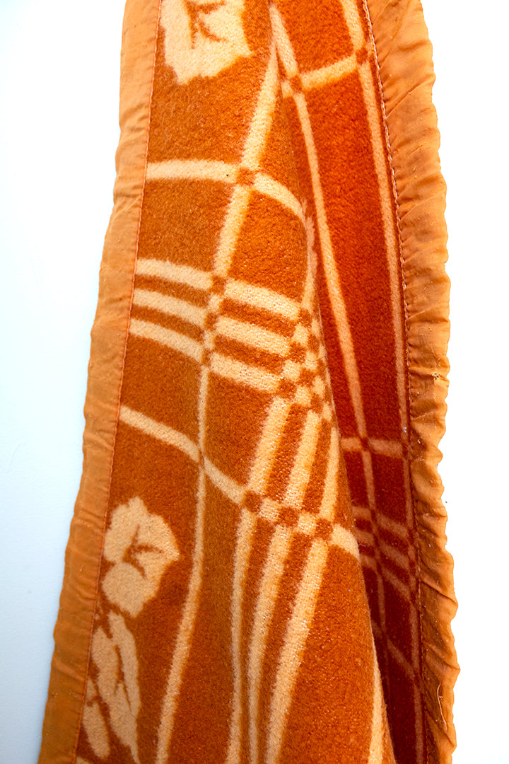 Oranje vintage wollen deken met bloemen