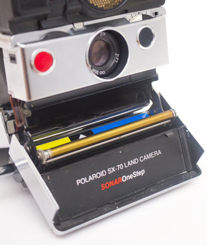 Polaroid SX-70 Sonar OneStep + 1000 display