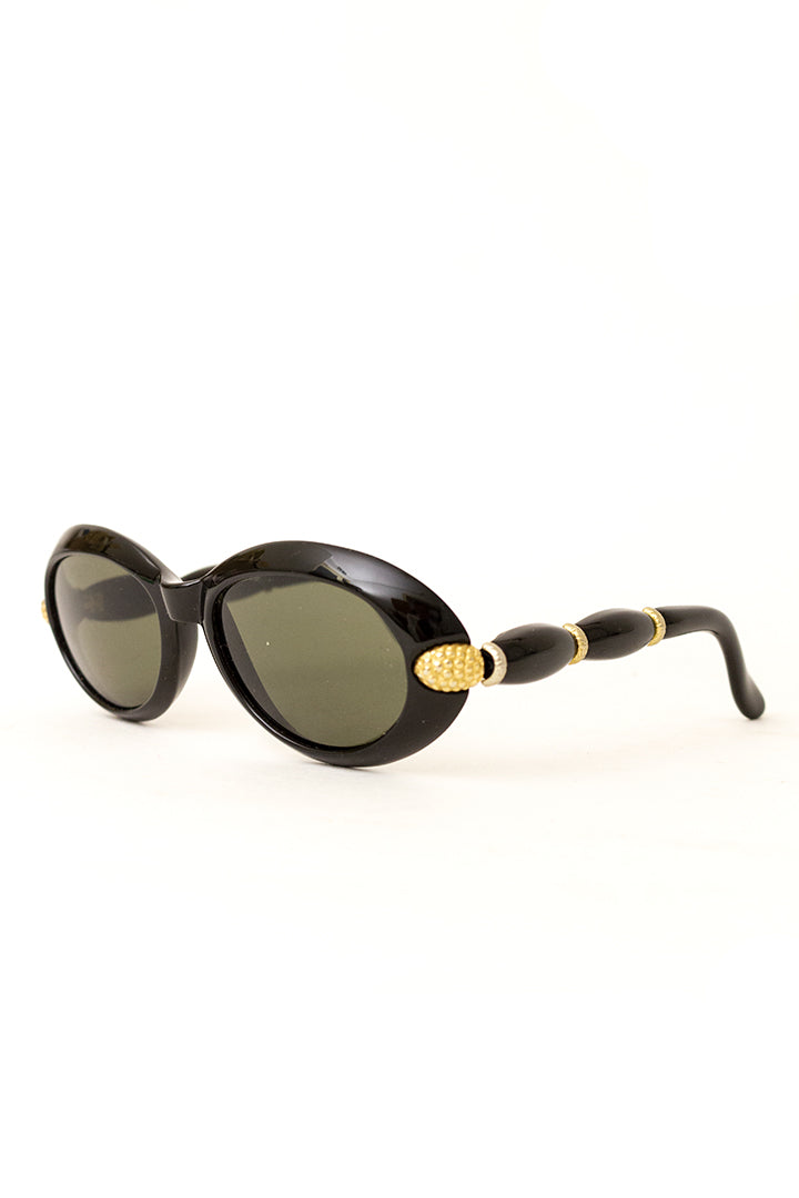 Vintage Rochas Paris zonnebril met zwart montuur en golvende pootjes