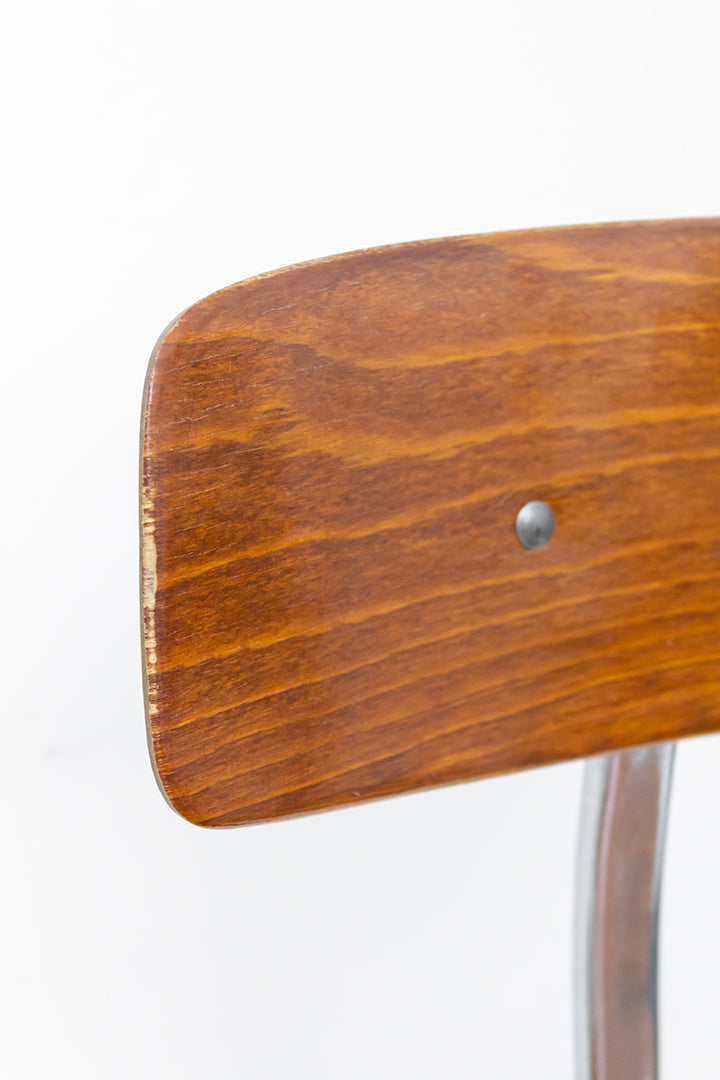 Vintage architectenstoel met houtfineer zitting en metalen frame