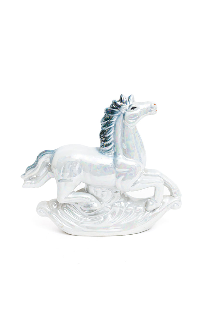 Vintage beeld van een springend paard blauw holografisch