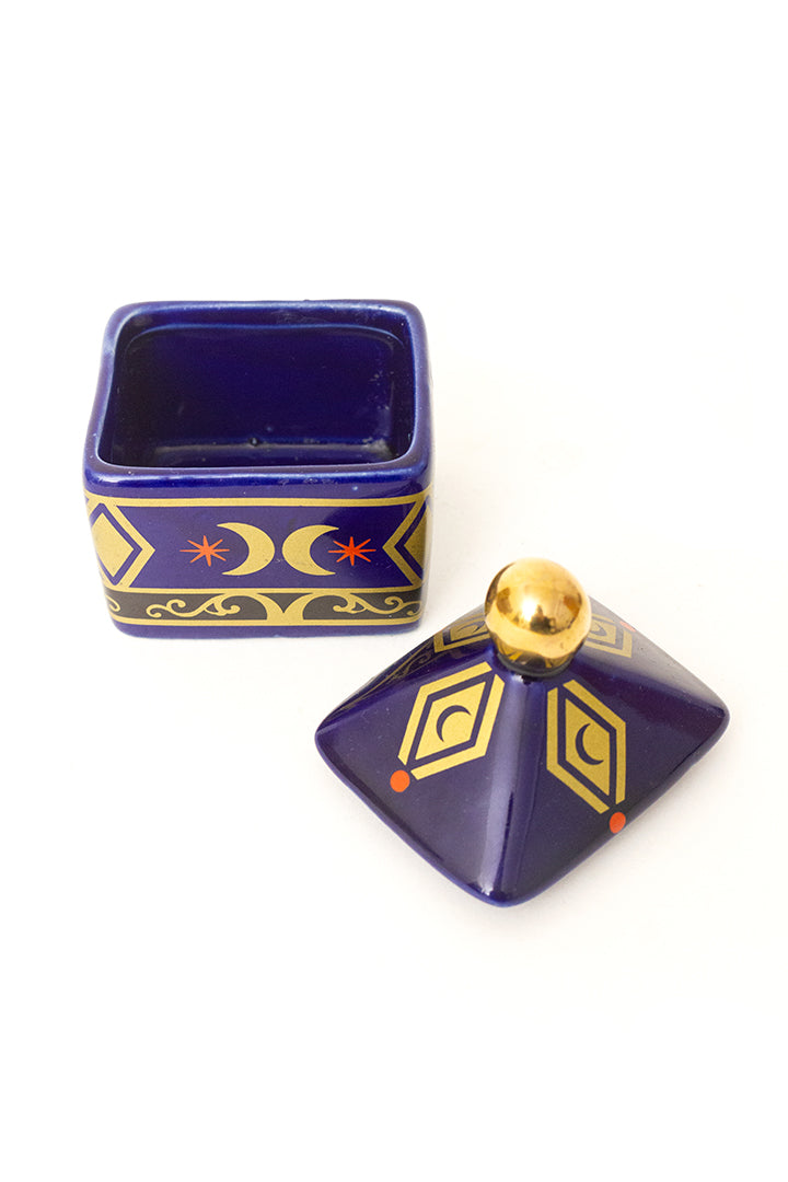 Vintage blauw keramieken potje met print van goudkleurige manen