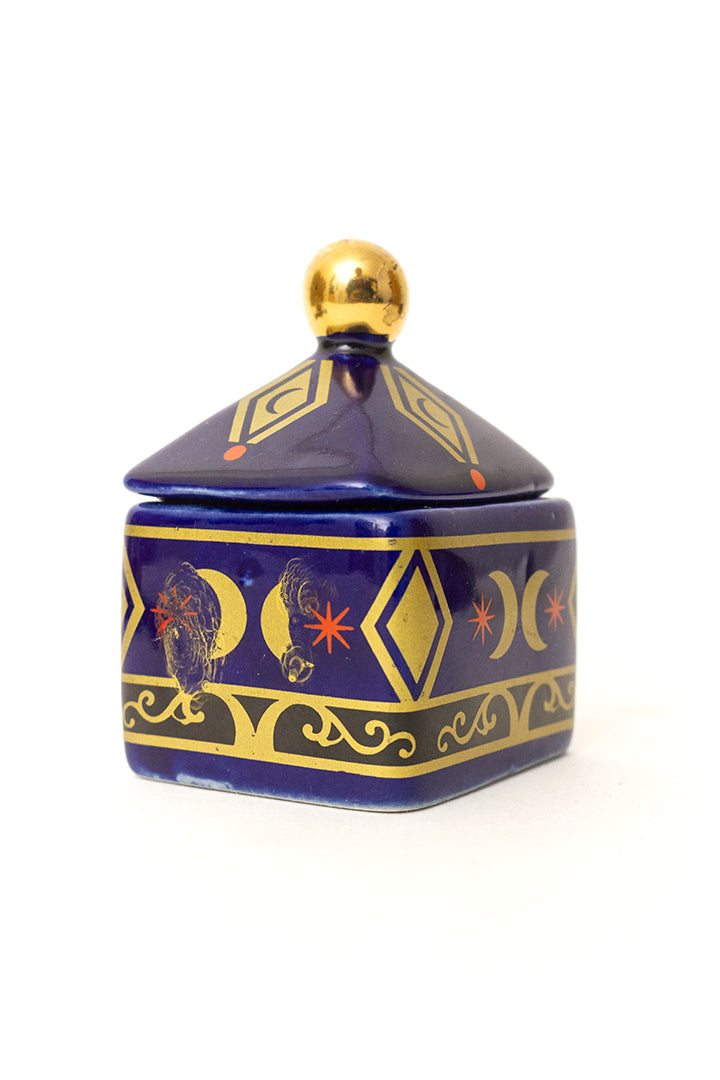 Vintage blauw keramieken potje met print van goudkleurige manen