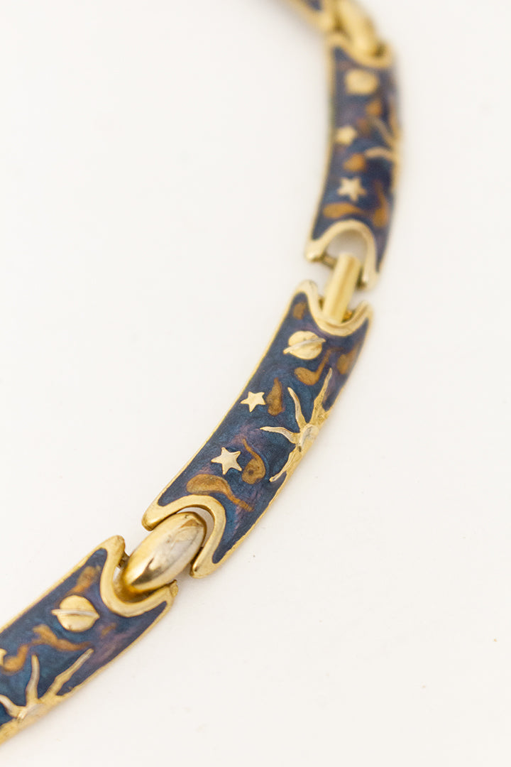 Vintage blauwe emaille ketting met zonnen en sterren