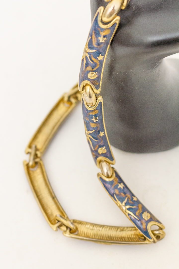 Vintage blauwe emaille ketting met zonnen en sterren