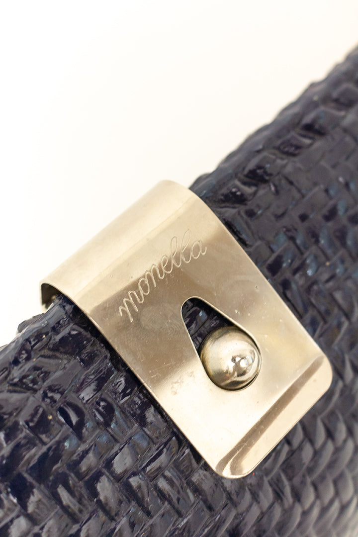 Vintage donkerblauwe clutch met geweven textuur Monella