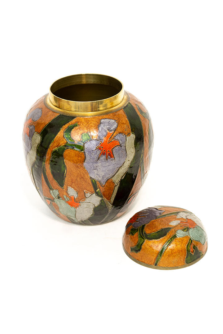 Vintage geëmailleerde oranje gemberpot met orchideeën