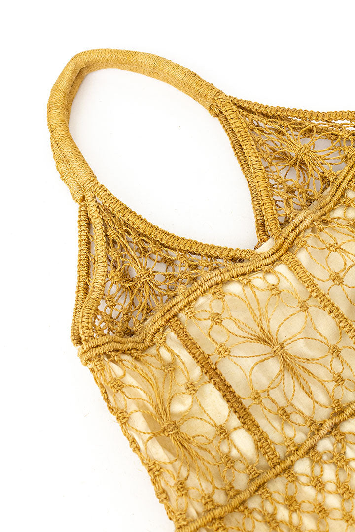 Vintage geknoopte raffia tas met witte katoenen voering