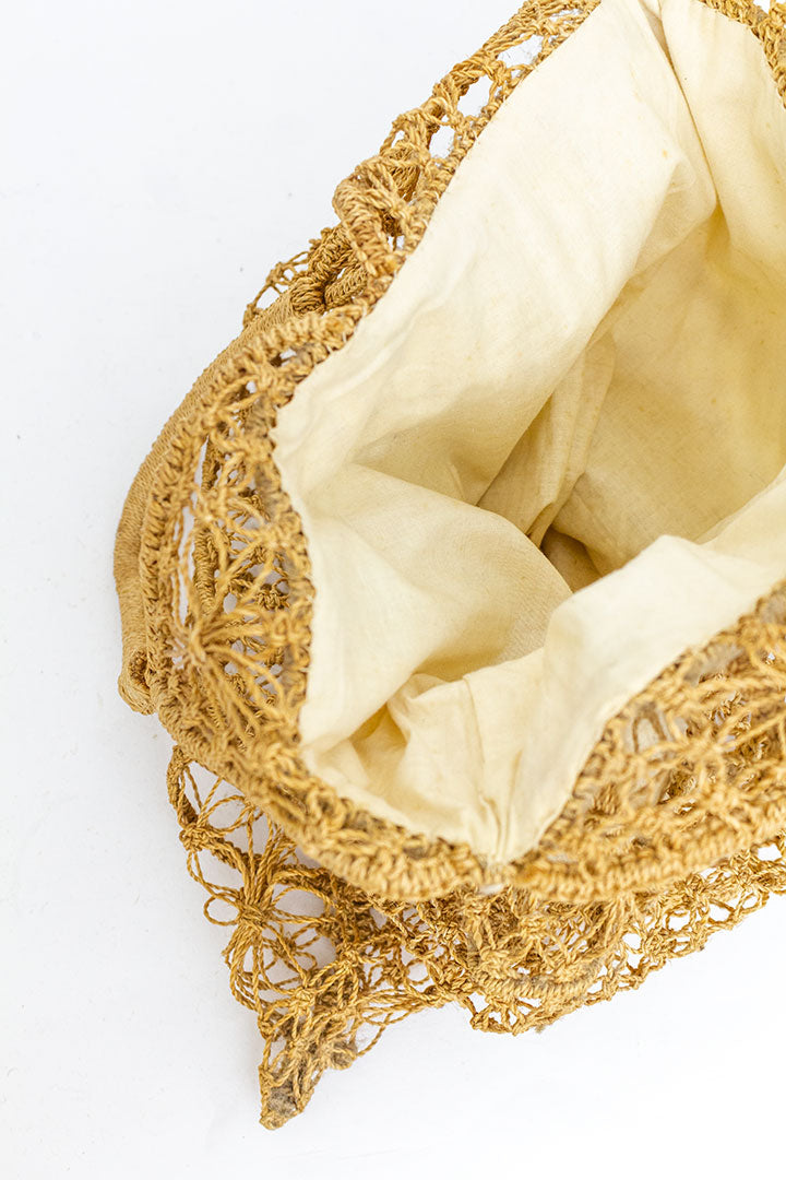 Vintage geknoopte raffia tas met witte katoenen voering