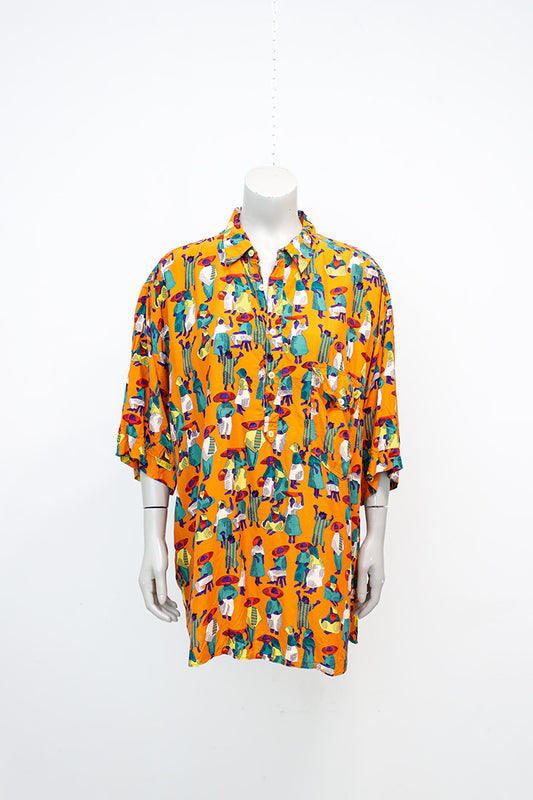 Vintage oranje blouse met kleurrijke print van figuurtjes