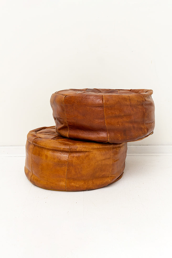 Vintage poef van bruin leer