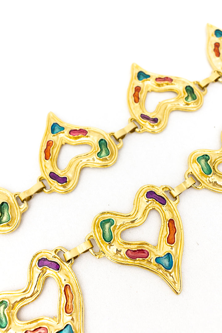 Vintage riem hartjes van goudkleurig metaal met gekleurde lak
