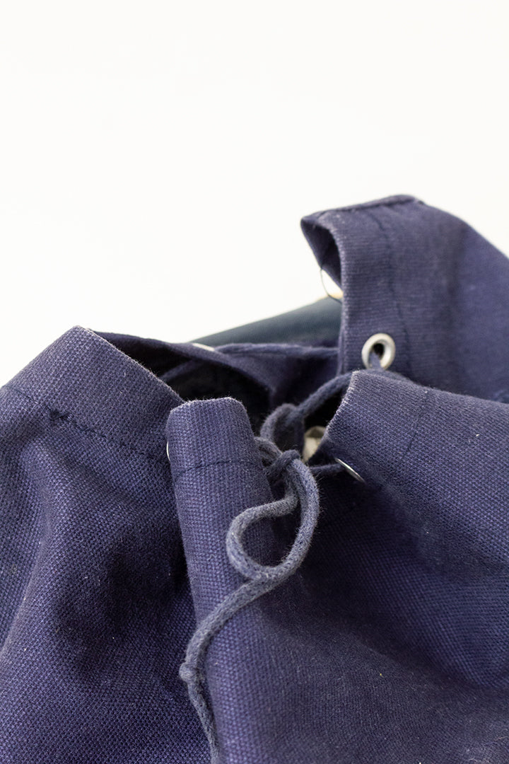 Vintage rugzak van donkerblauw katoen met leren details
