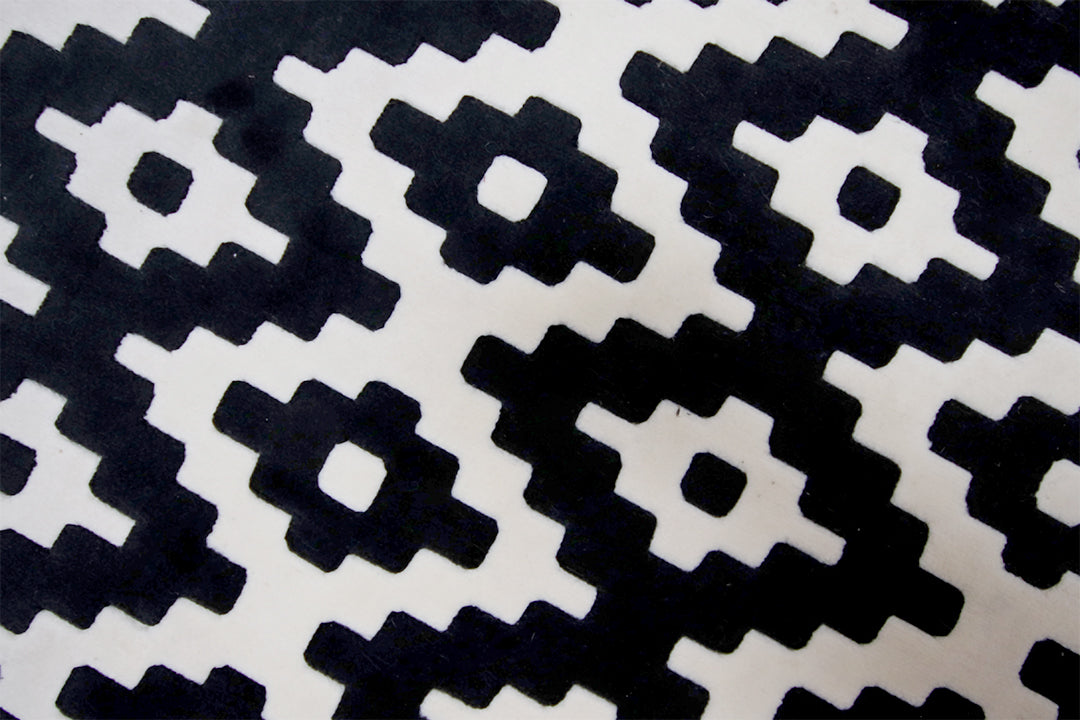 Vloerkleed met grafisch zwart/wit patroon