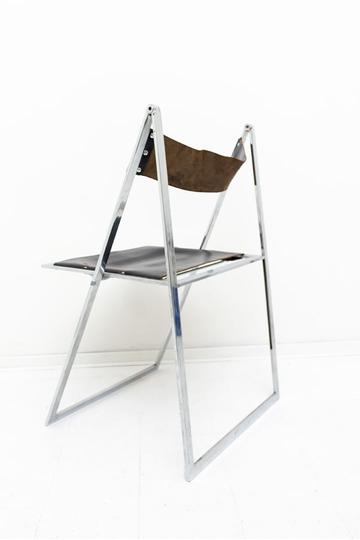 Vono Lübke vintage klapstoel met verchroomd frame en zwarte leren zitting