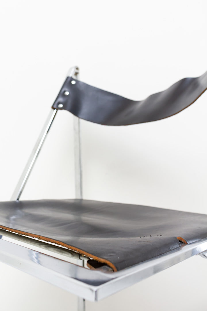 Vono Lübke vintage klapstoel met verchroomd frame en zwarte leren zitting
