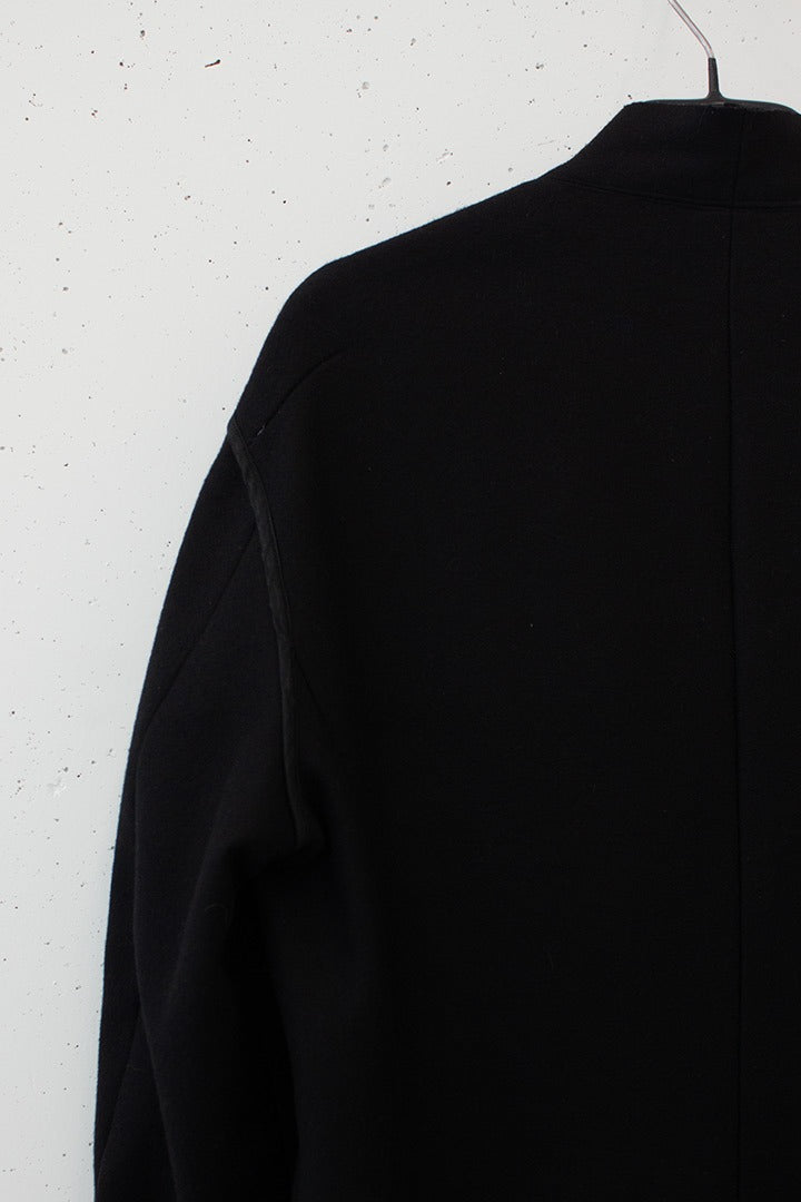 Zwarte wollen Dries van Noten jas knoopjes detail