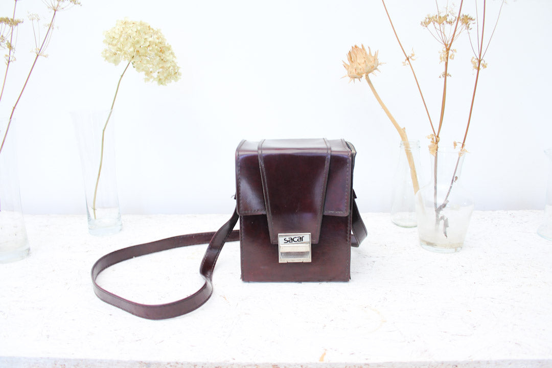 Bruine vintage Polaroid Sacar cameratas