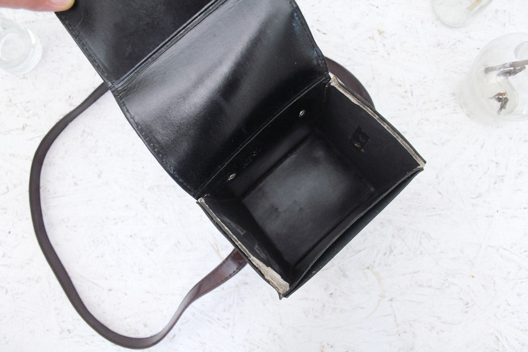 Bruine vintage Polaroid Sacar cameratas