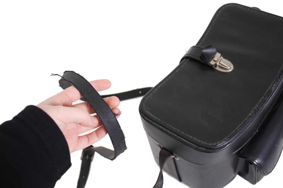 Zwarte vintage cameratas met voorvak