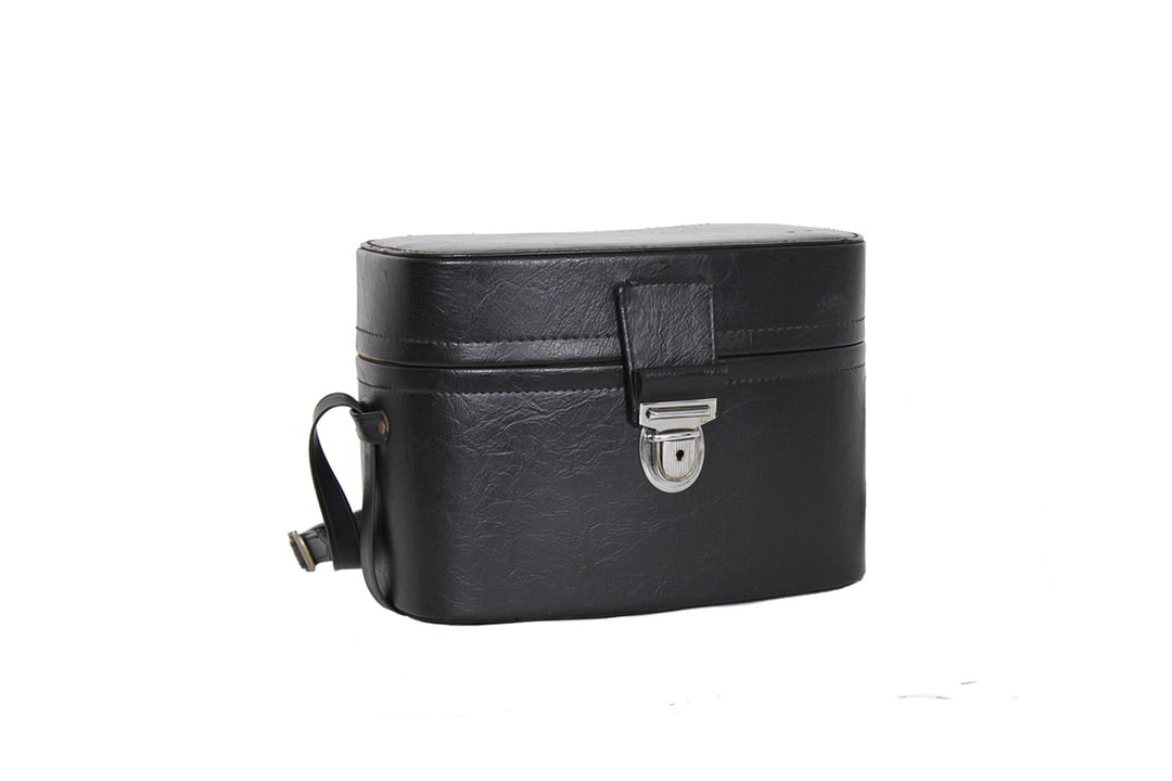 Zwarte vintage camerakoffer met gele voering